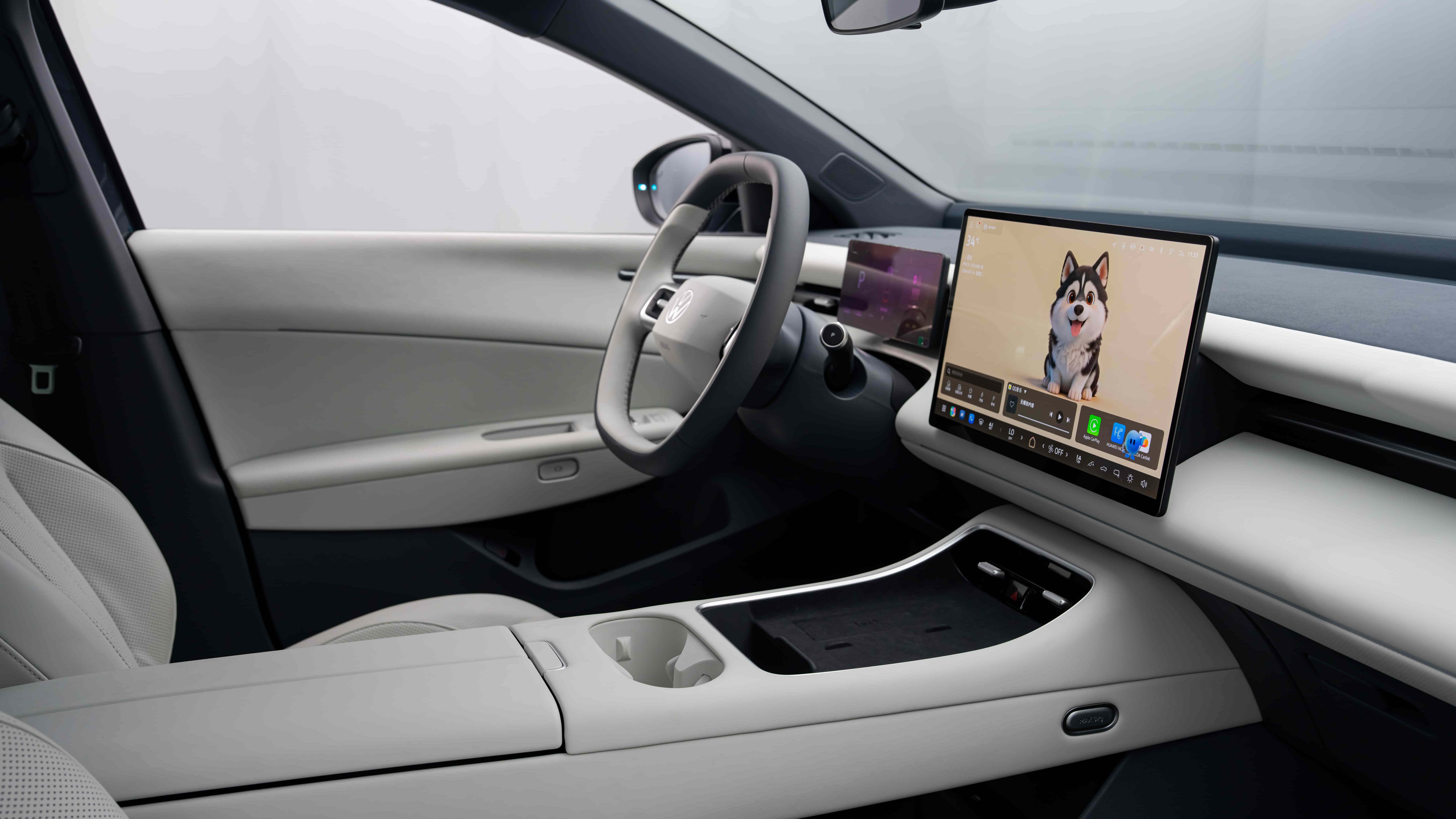 Modern Volkswagen vehicle interior featuring a digital cockpit, multifunction steering wheel, compact driver display and a large central touchscreen with AI-powered infotainment functions. The minimalist cabin design highlights advanced software-defined vehicle technology and intelligent user experience.