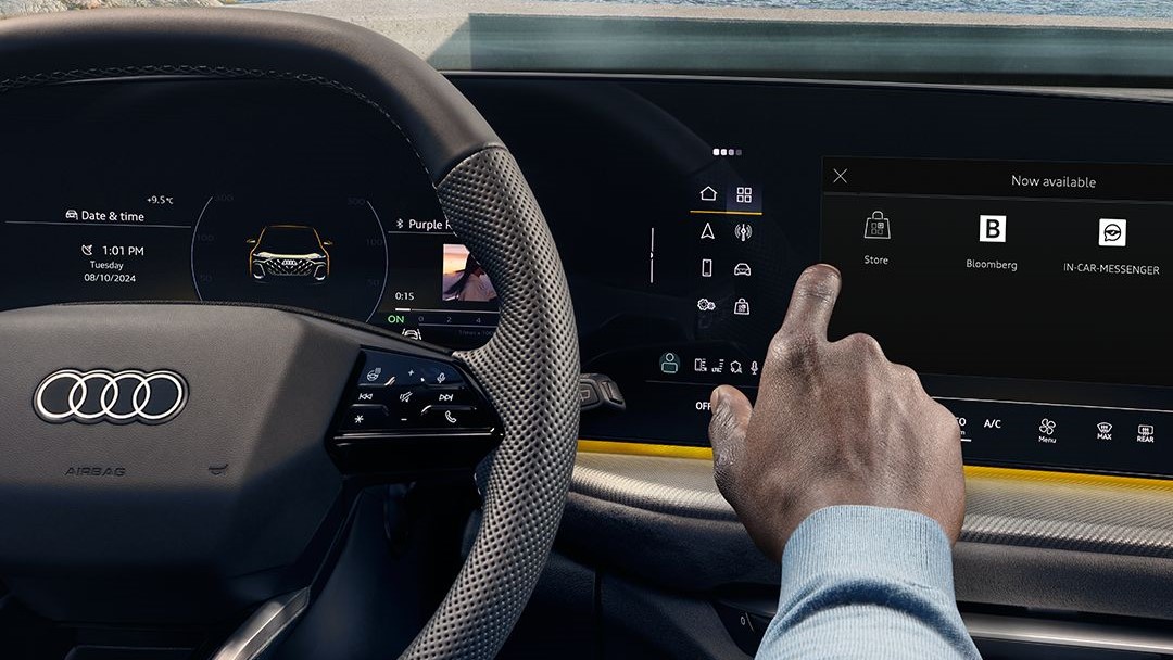 Audi car dashboard with touchscreen showing options like 'Banking' & steering wheel visible.