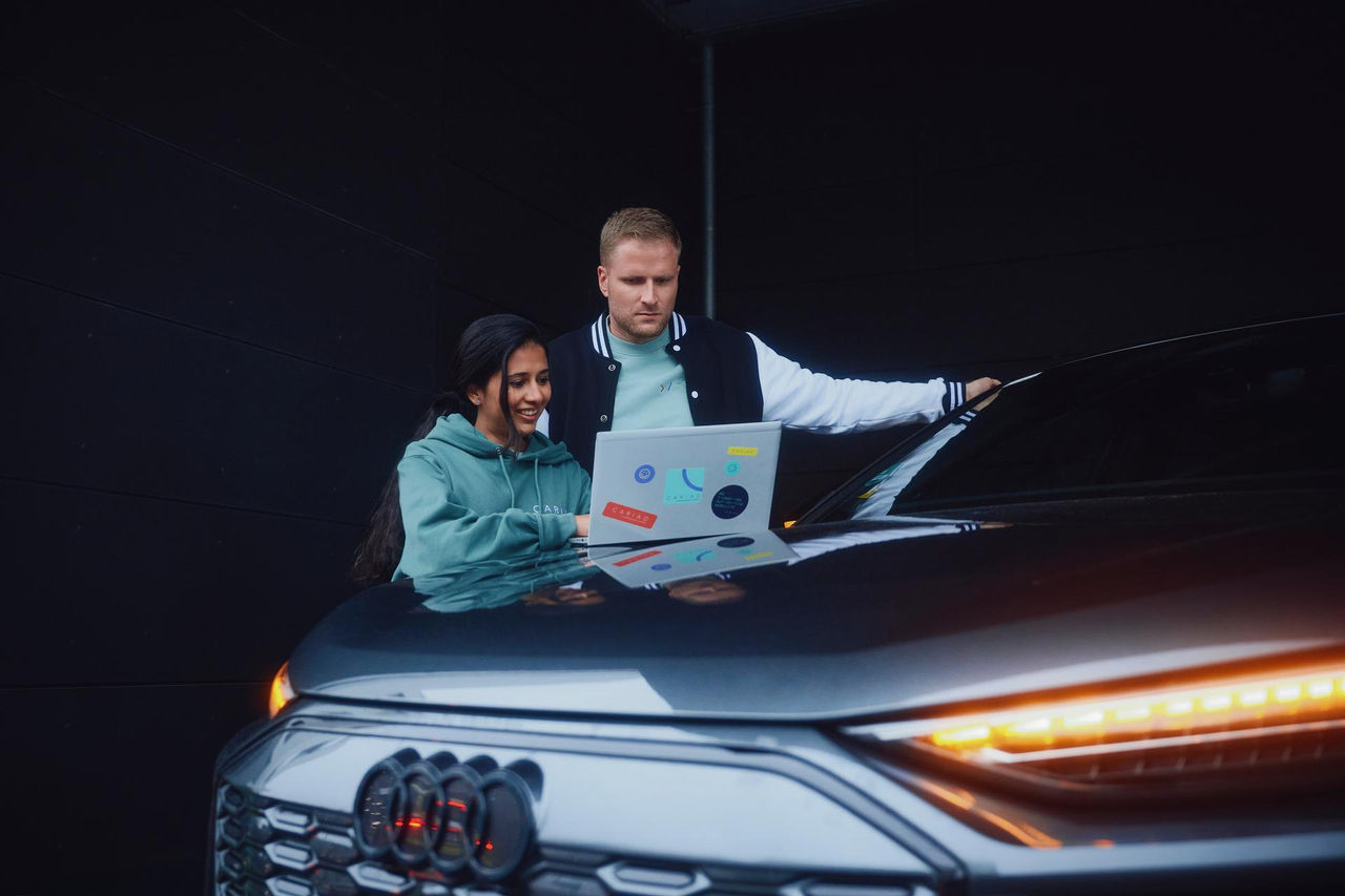 The Audi e-tron Sportback driving on a bridge at sunset