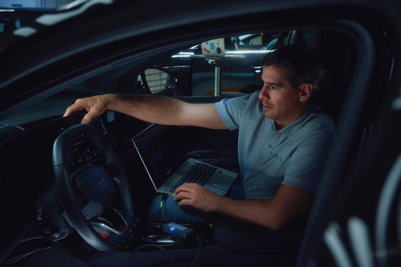 men driving an electric car