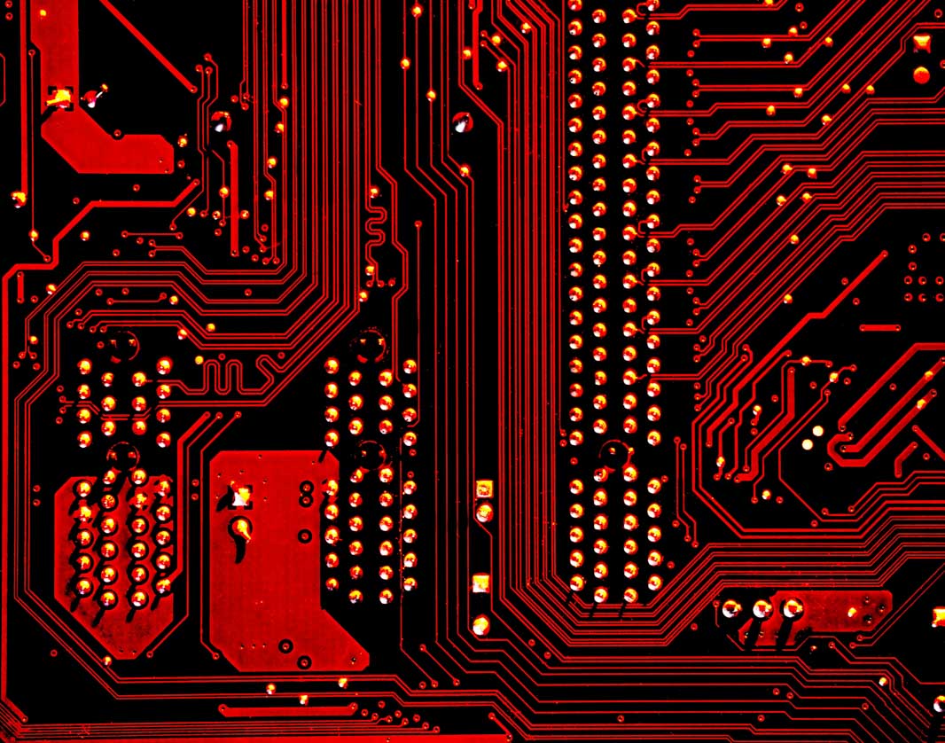Close-up of a motherboard, tinted red