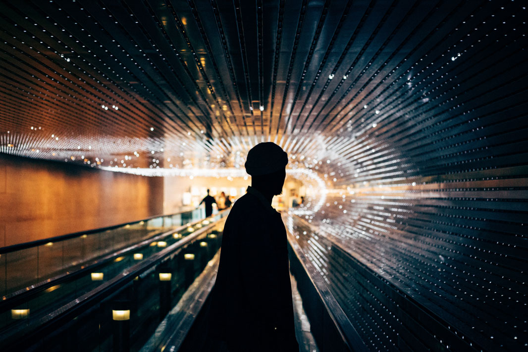 Silhouette of a man in front of a futuristic looking setting